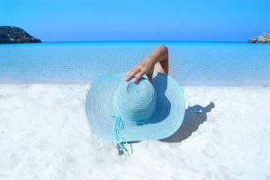 A lady taking her summer vacation on a beach