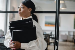 a bookkeeper holding ledgers